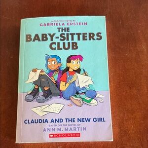 Scholastic The Baby-Sitters Club Graphic Novel with Blue and Pink Accents